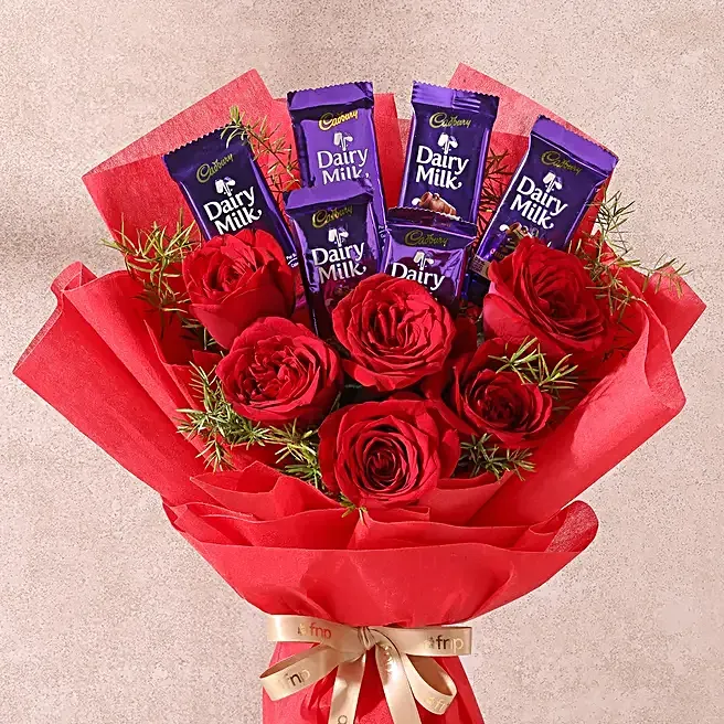 red-roses-bouquet-with-dairy-milk-chocolates_2.webp